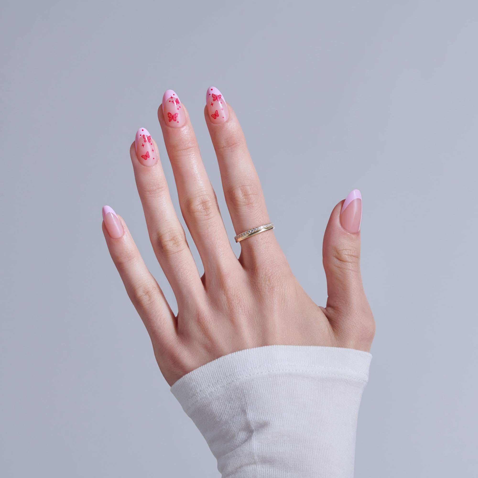 Close up of KISS Core almond shape pink press on nails