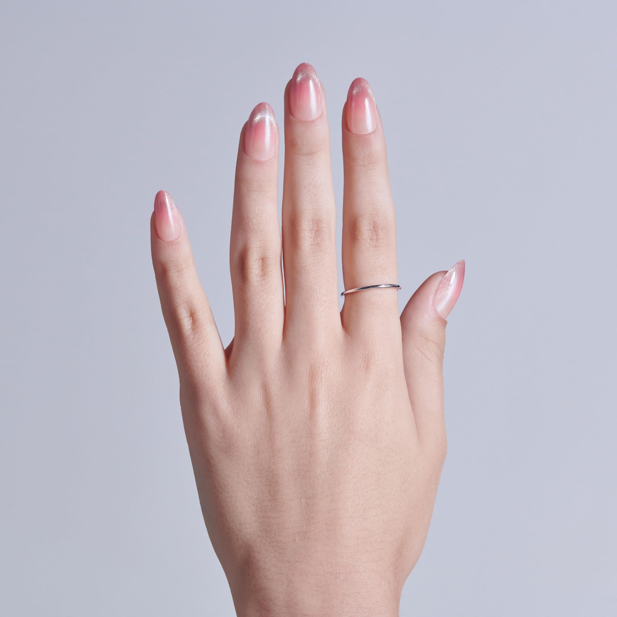 Side profile view of Kiss Glam pink almond nails
