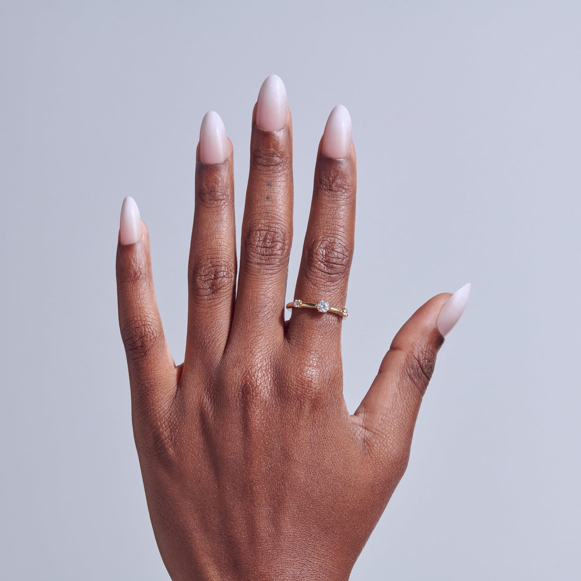 Close up of Dulcet pink almond shaped false nails