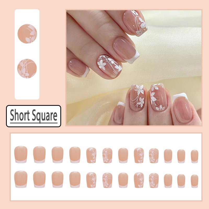 Close up of square short white floral fake nail design