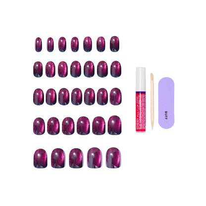 Contents of Kiss Glam nail kit including glue and manicure file