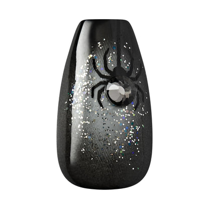 Detailed shot of glossy black coffin press on nails