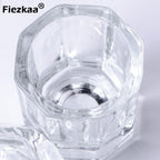 Top down view of Fiezkaa glass nail liquid bowl on a salon table