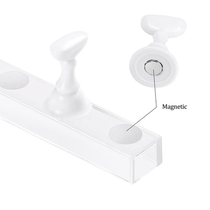 Close up of magnetic nail practice holder with false nail tip