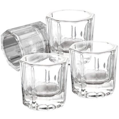 Four clear glass dappen dishes for professional nail salon use