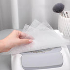 Stack of white disposable nail dust filter sheets