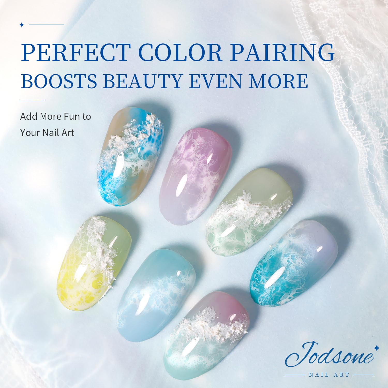 Manicure hands displaying finished marble and ocean wave watercolor nail art designs