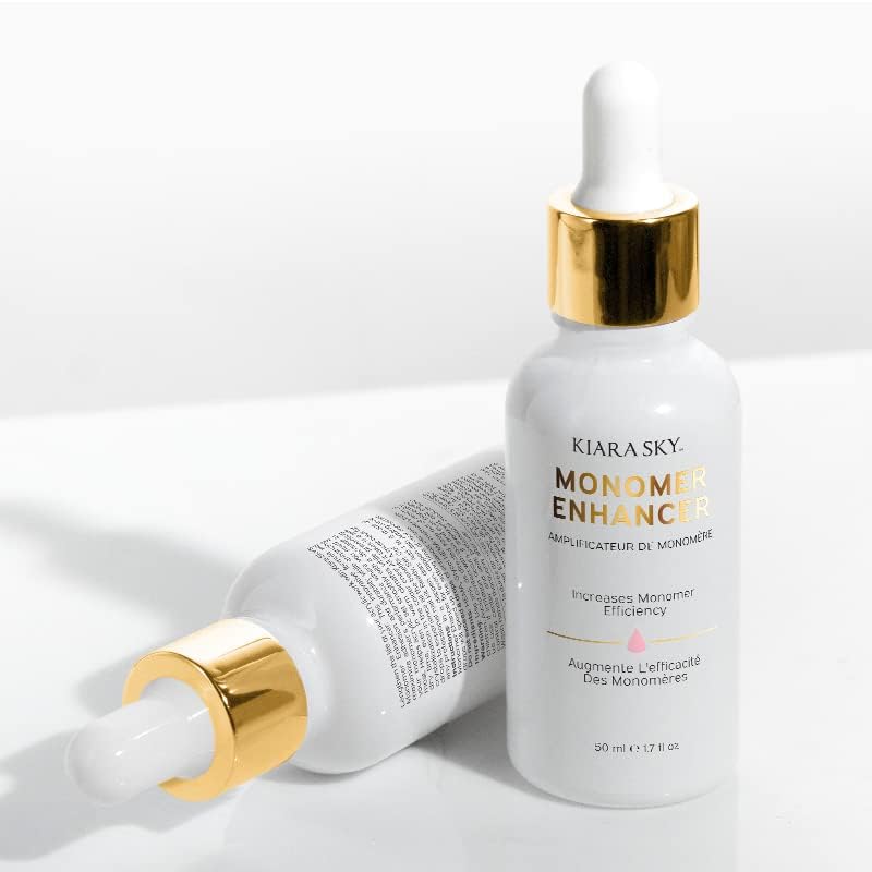 Kiara Sky liquid monomer enhancement formula placed on a clean professional salon workspace setup.