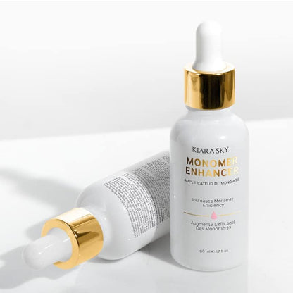 Kiara Sky liquid monomer enhancement formula placed on a clean professional salon workspace setup.