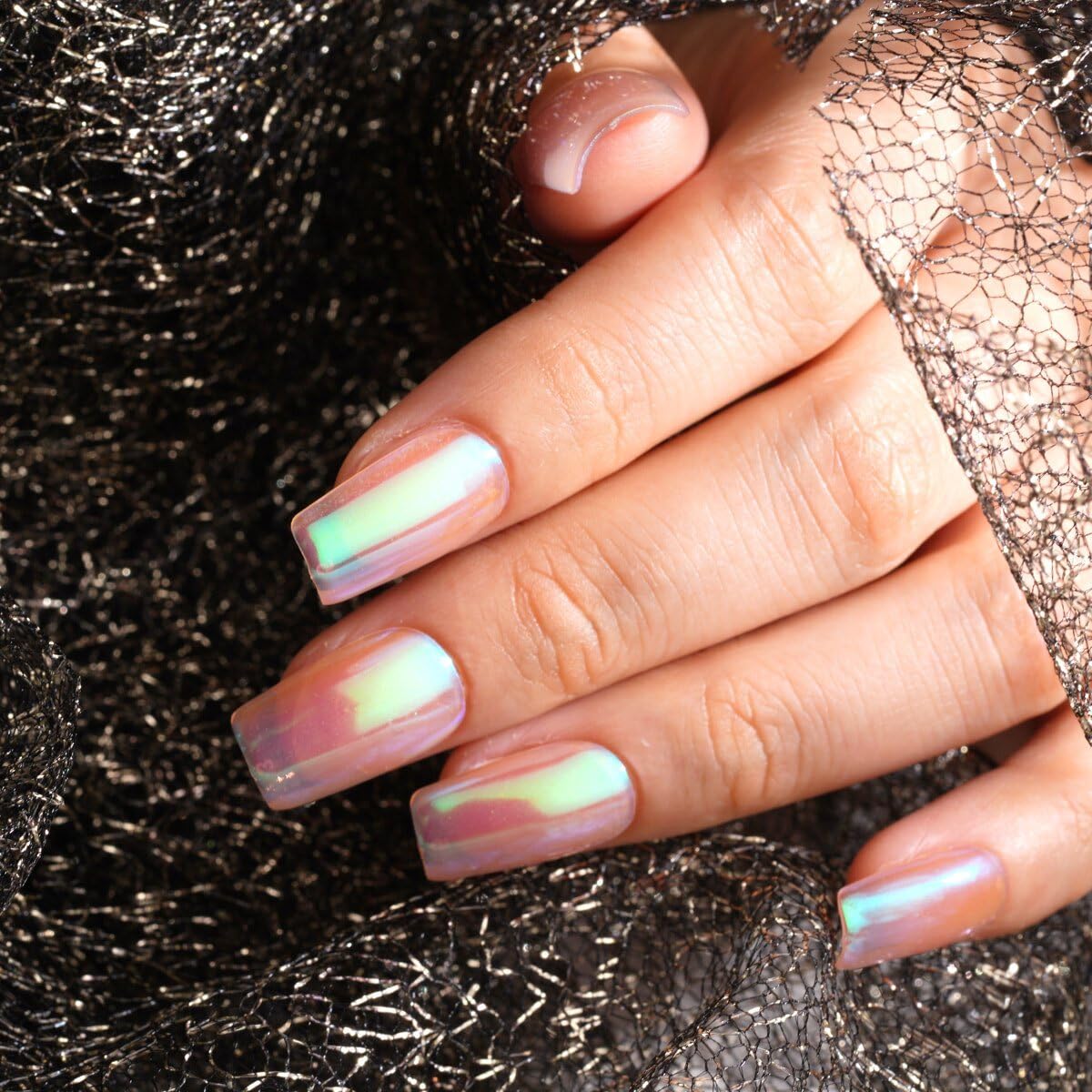High gloss unicorn chrome finish on manicure