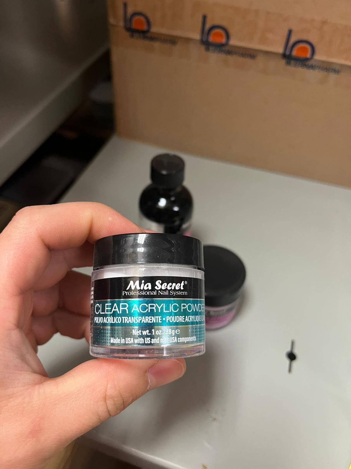 Close up view of the packaging for Mia Secret advanced non yellowing liquid monomer
