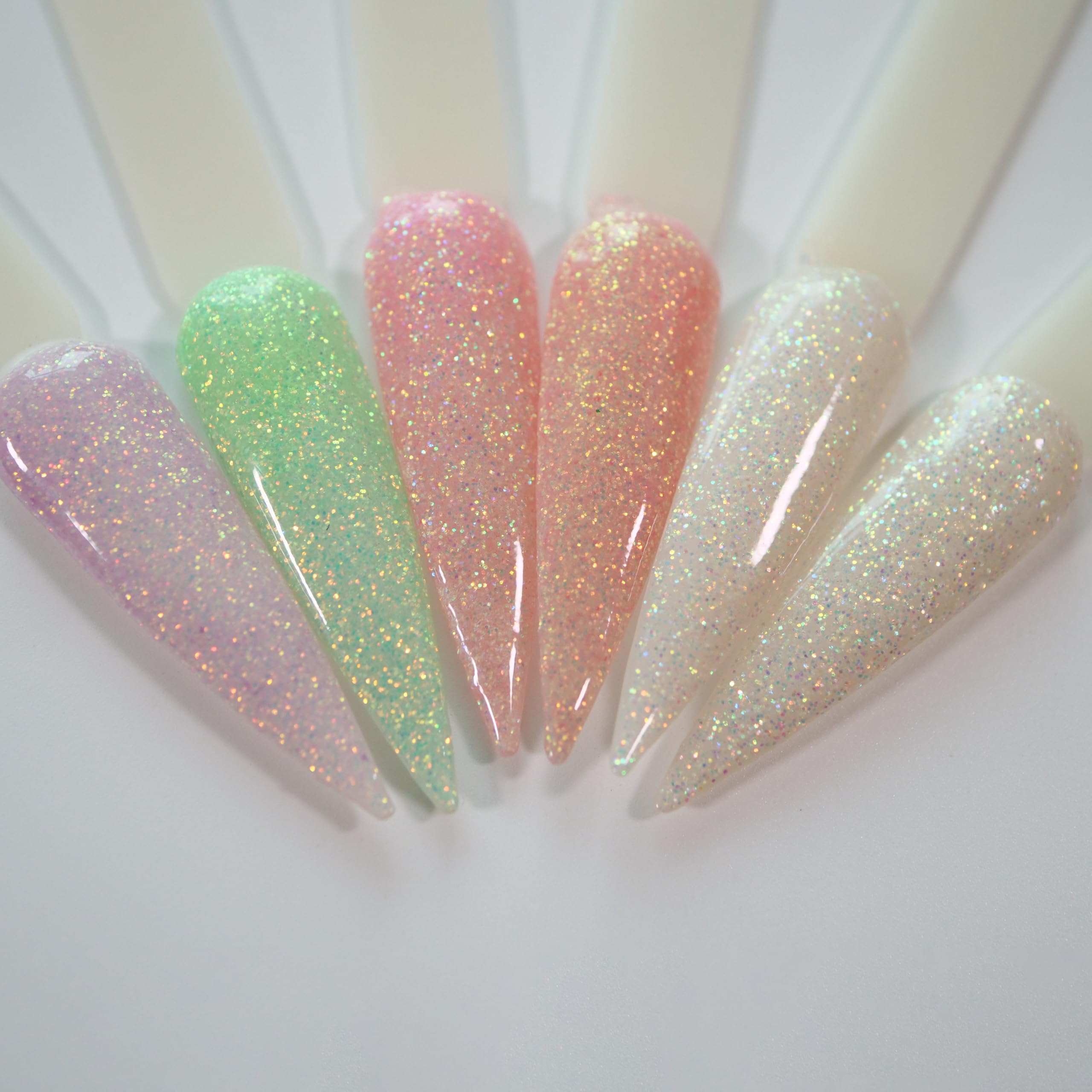 Professional nail technician applying Oumisaya glow powder