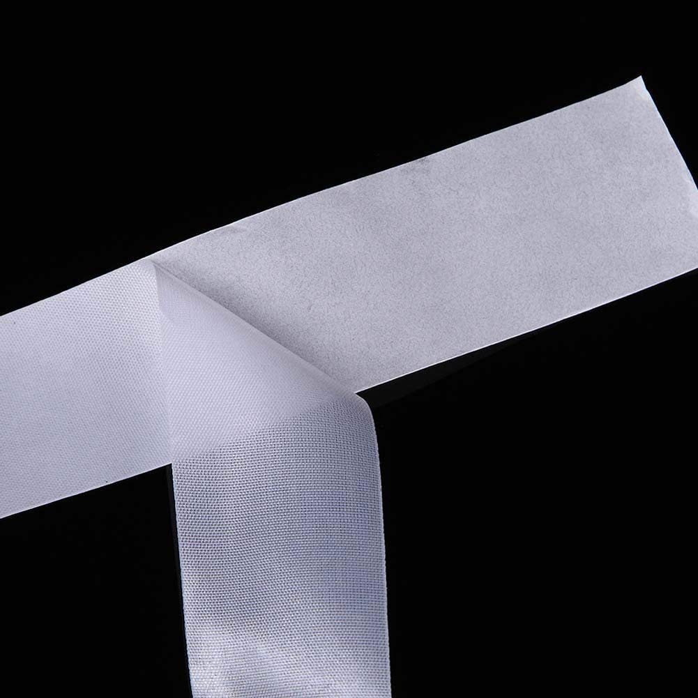 Self adhesive silk nail wrap tape roll extended on white background