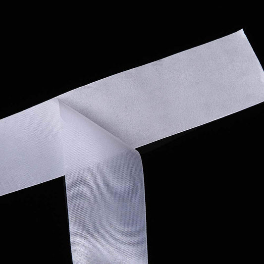 Self adhesive silk nail wrap tape roll extended on white background