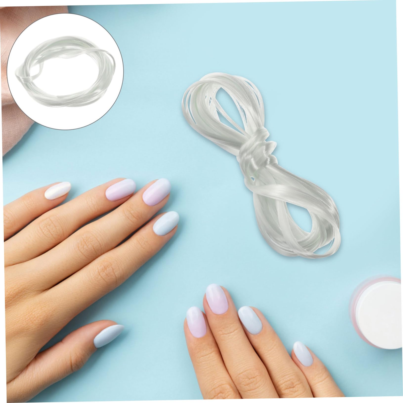 Manicure salon tool showcasing the transparent lightweight structure of false nail extension fibers.