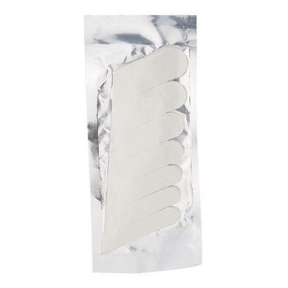 Close-up view of clear self-adhesive silk fabric nail patch being applied to a cracked fingernail tip.