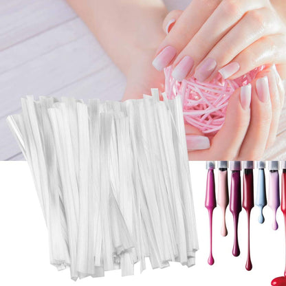 Professional nail specialist shaping the cured fiberglass extension strips with a file