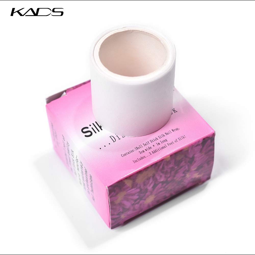 Self adhesive silk nail wrap roll pulling out from the top slit of the KADS box.
