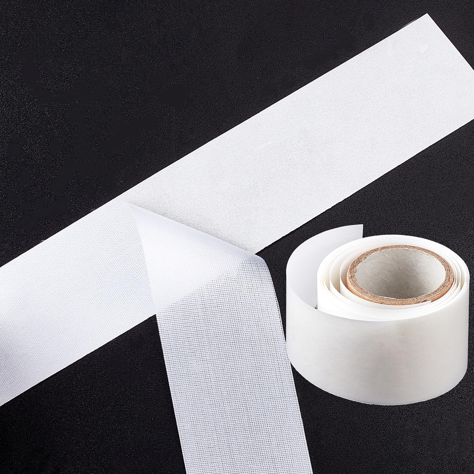 Fiberglass silk nail wrap being applied to a fingernail
