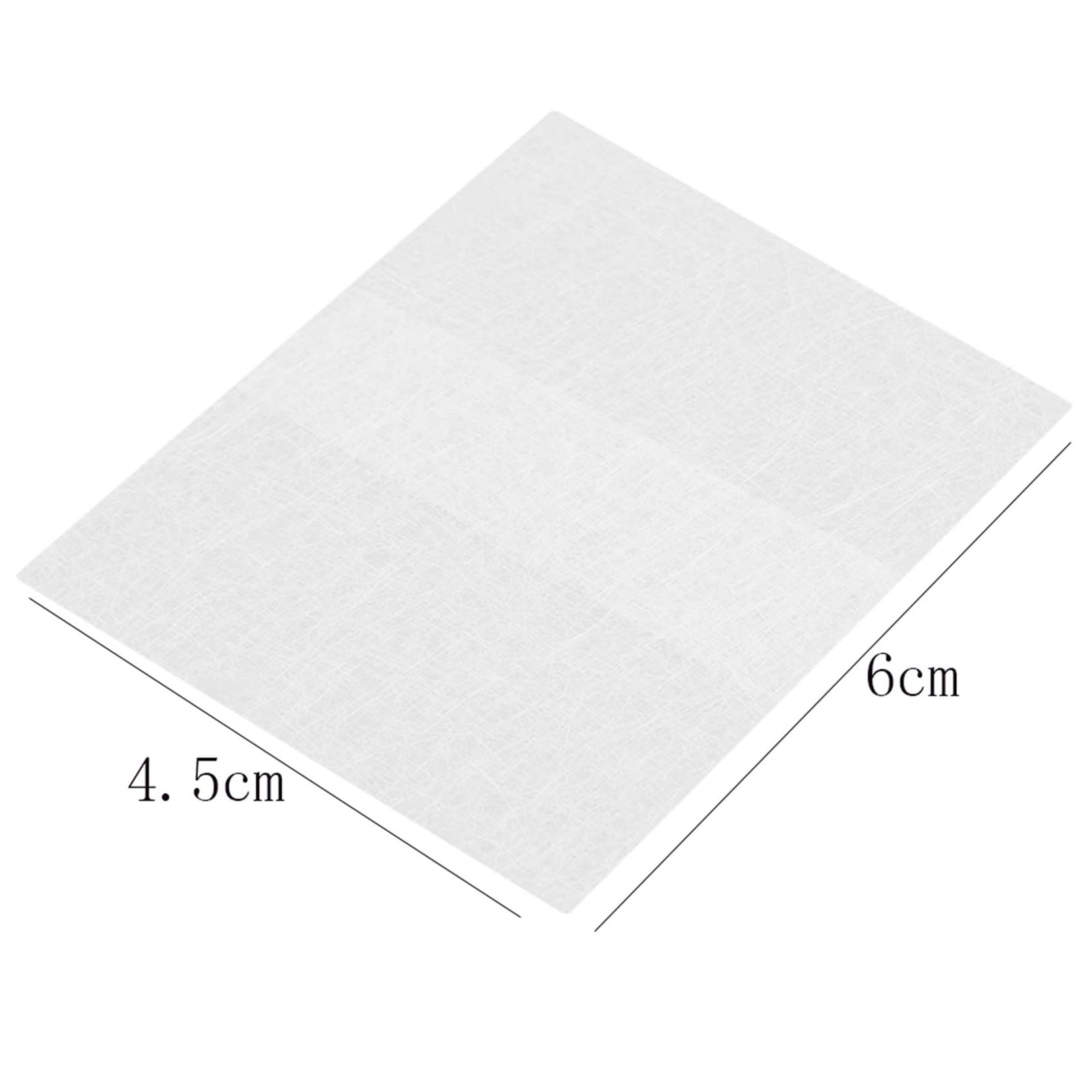 Close-up of the ultra-lightweight non-woven fiber material being measured and cut with scissors.