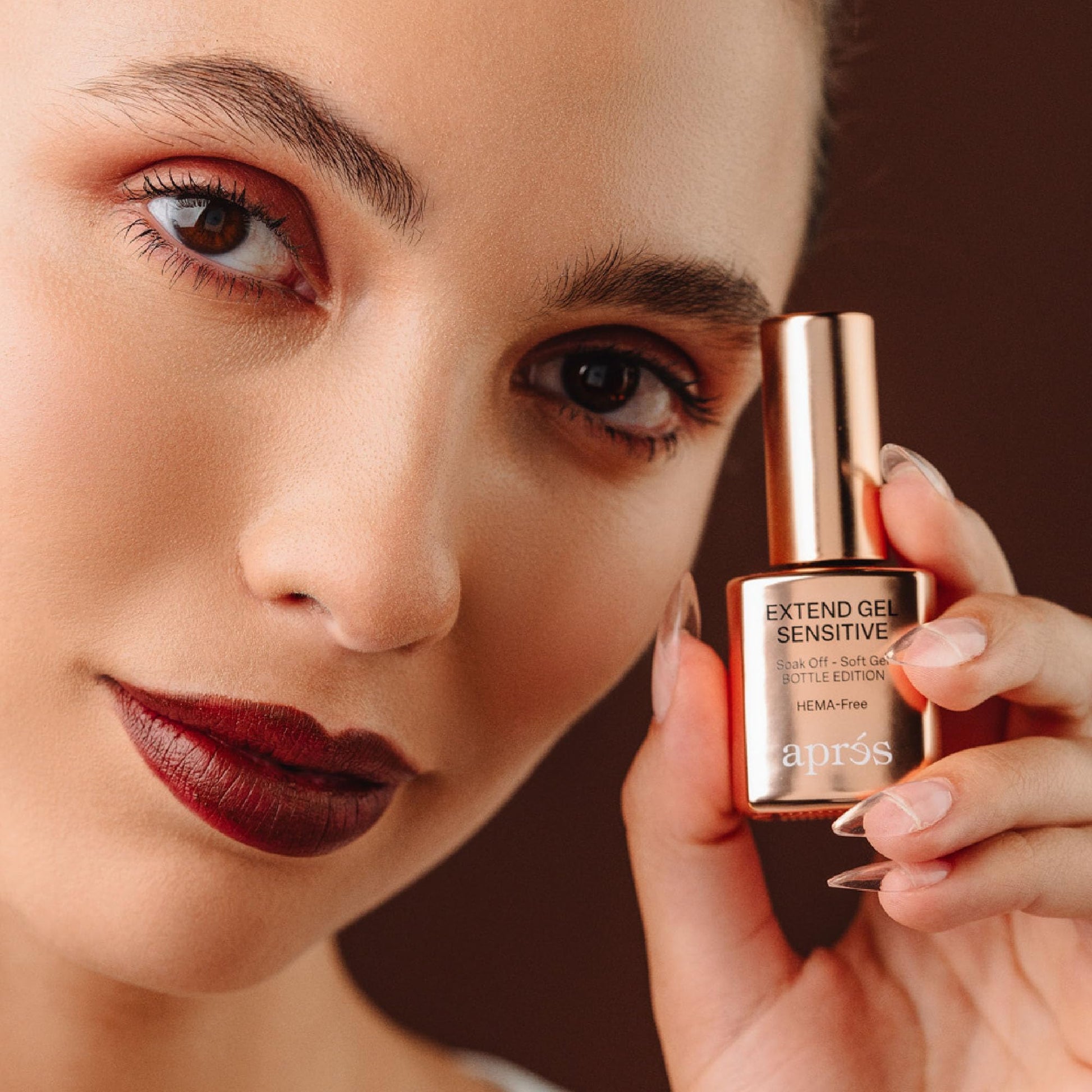 Side profile of AprÃ©s Extend Gel Sensitive bottle