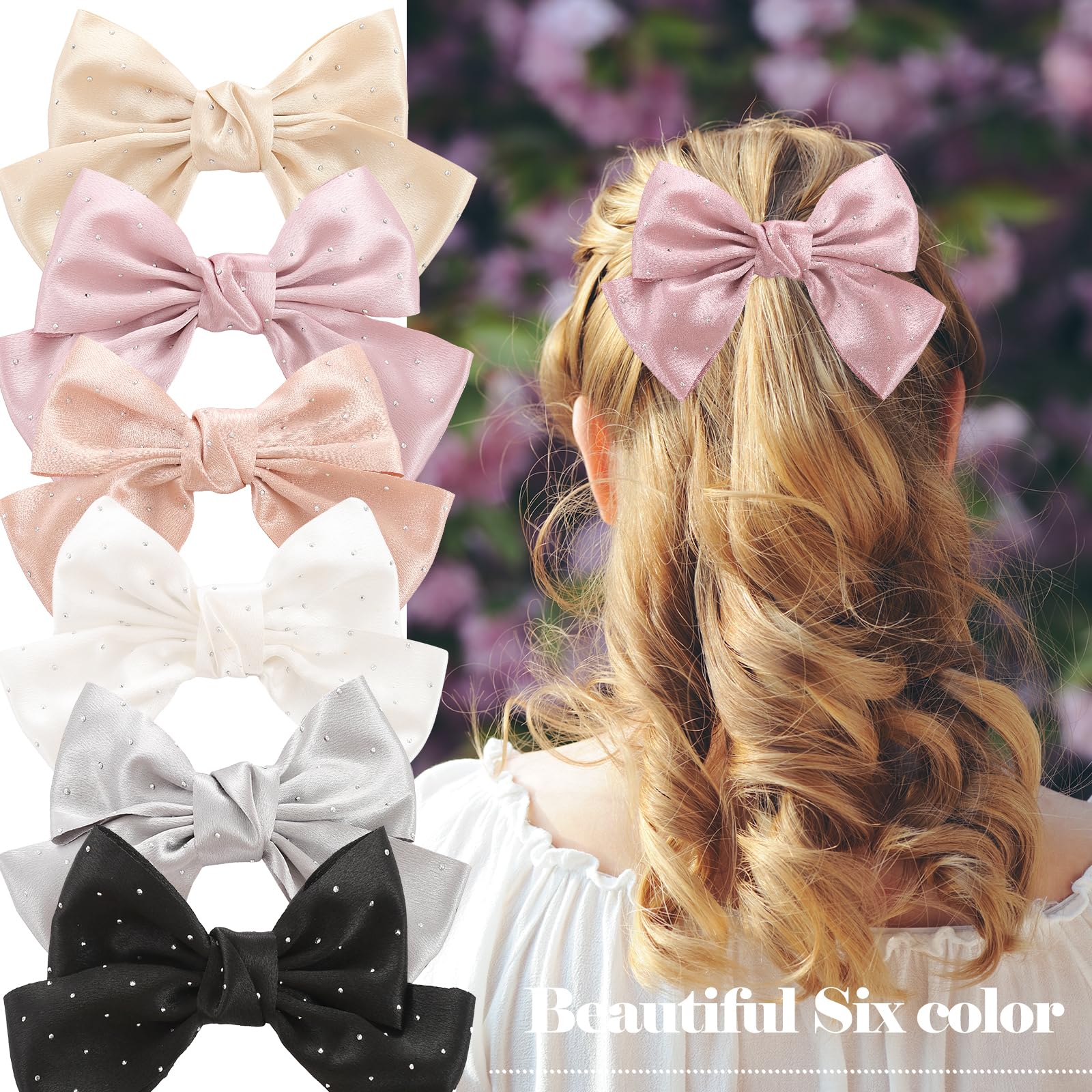 Handmade satin ribbon hair bows with crystal rhinestone center pieces in a flat lay view.