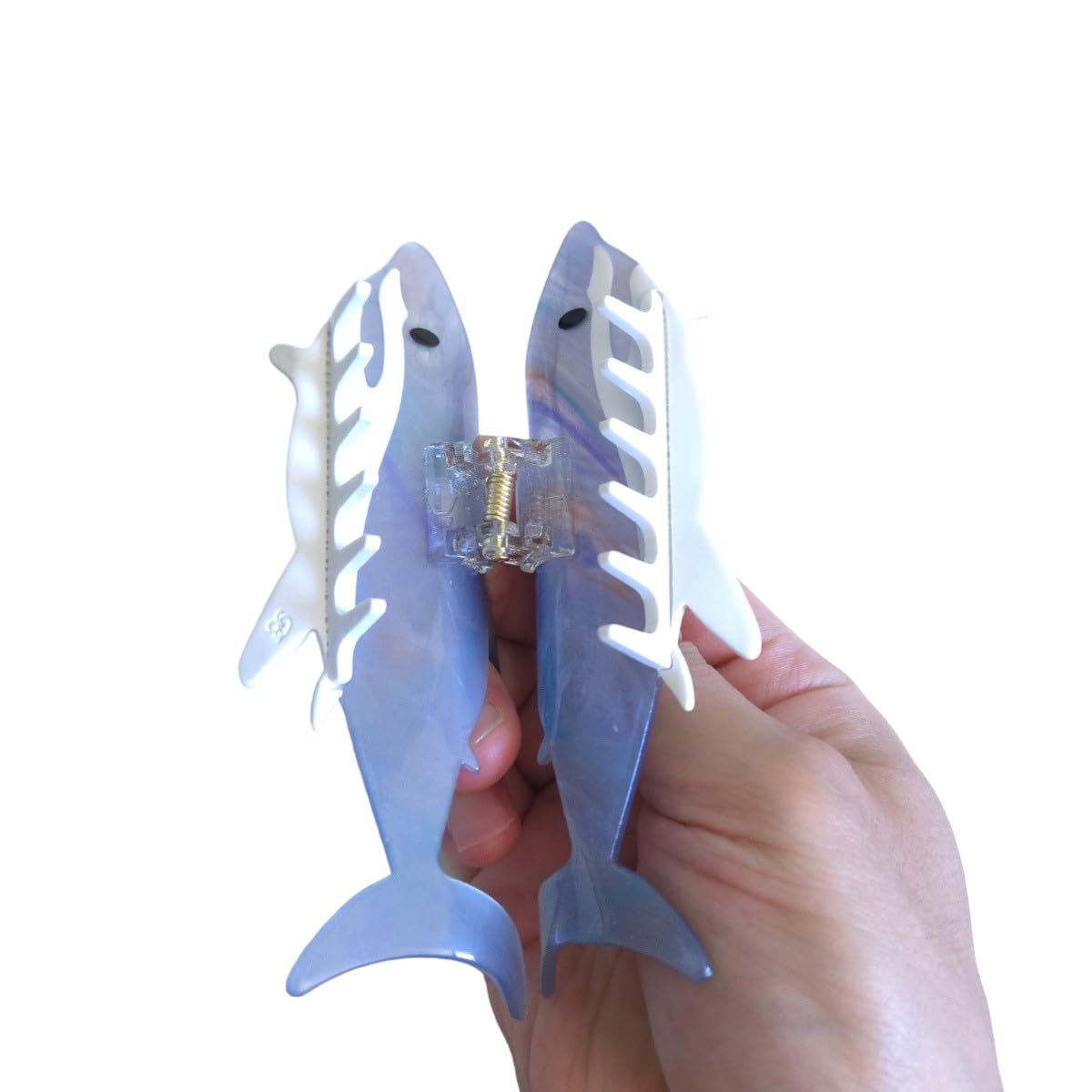 Model showing how the large greyblue shark claw clip securely holds thick long hair in a casual updo lifestyle shot.