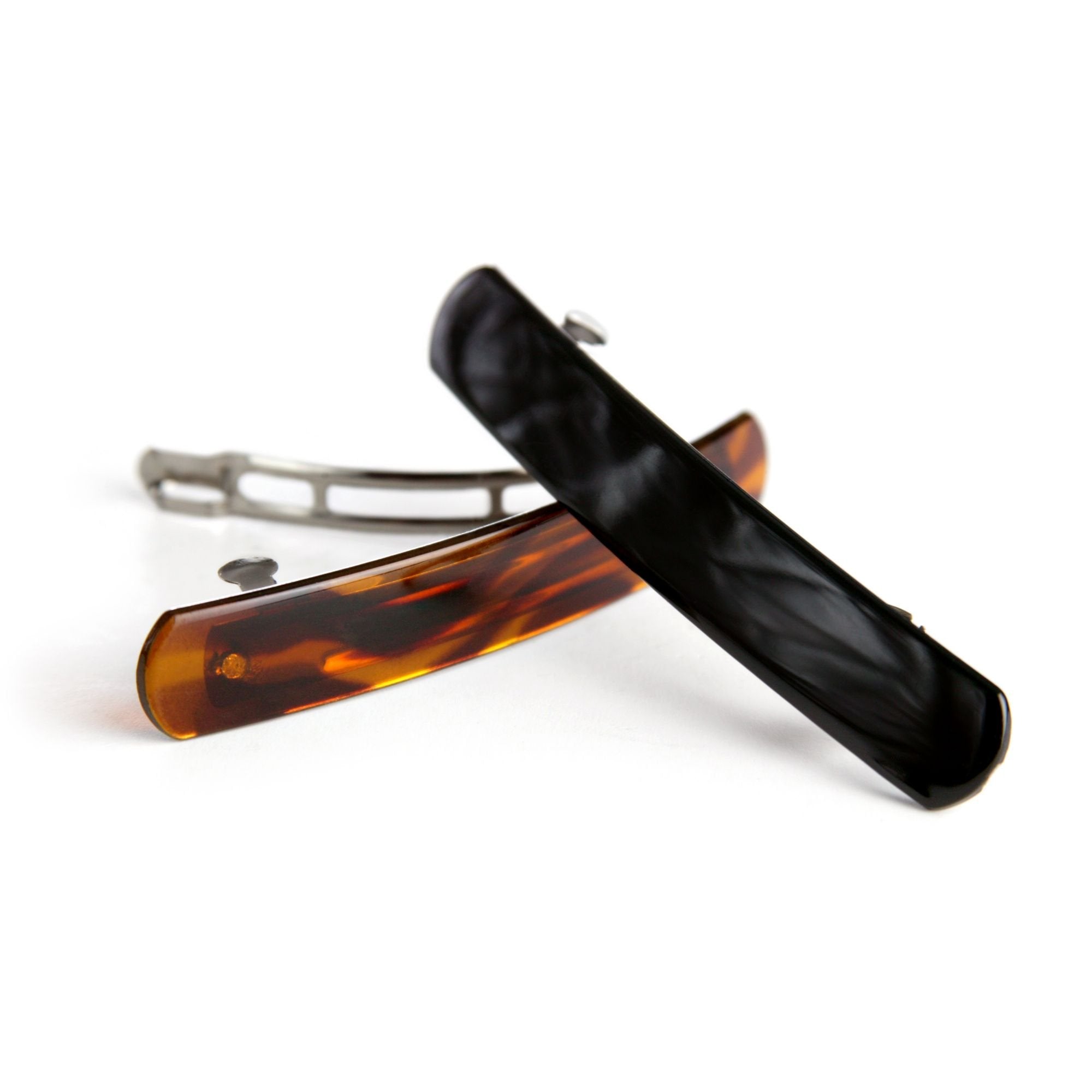 Solid black rounded hair clip demonstrating secure hold
