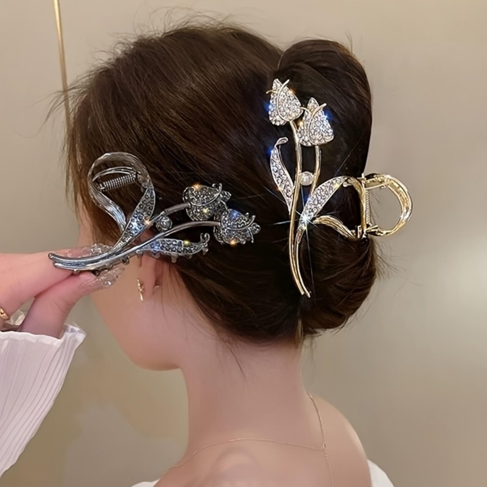 Close up view of the shimmering faux rhinestones on the silver tone floral jaw clip
