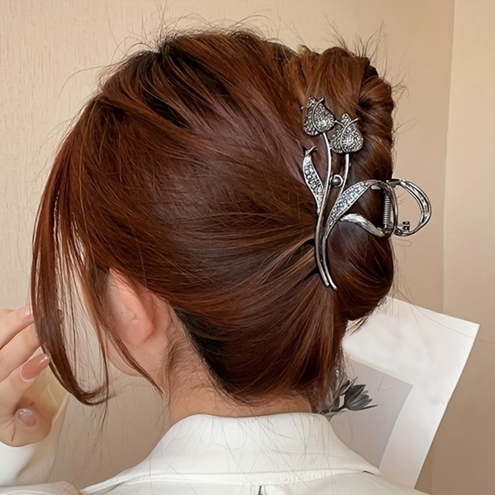 RHOSYN luxury metal hair claw barrette resting on a clean vanity countertop display