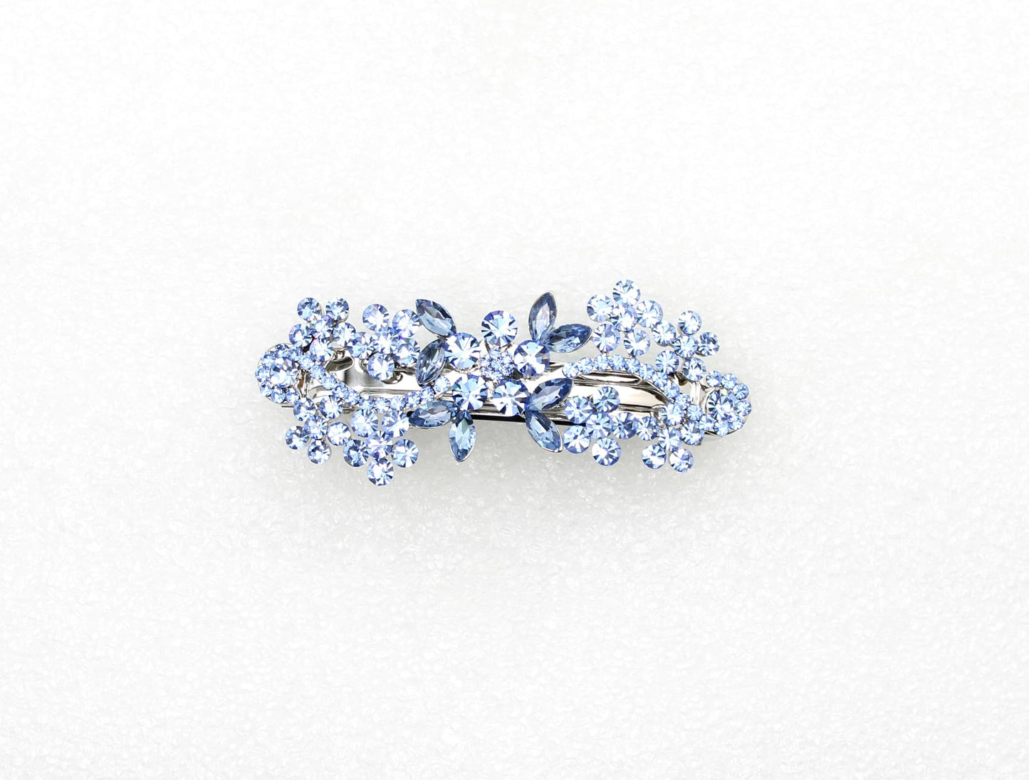 Luxury floral crystal hair accessory in silver tone metal setting showcasing shimmering rhinestones