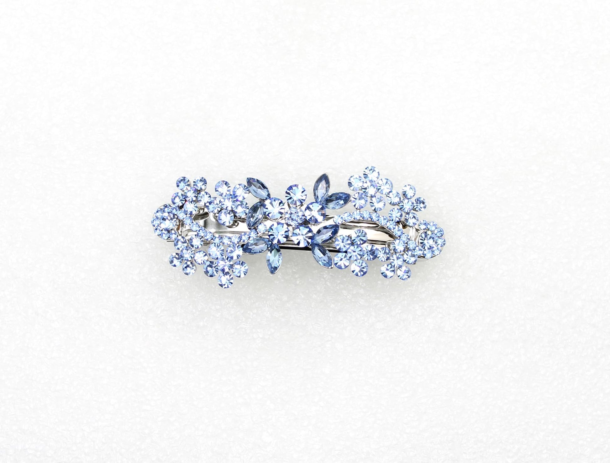 Luxury floral crystal hair accessory in silver tone metal setting showcasing shimmering rhinestones