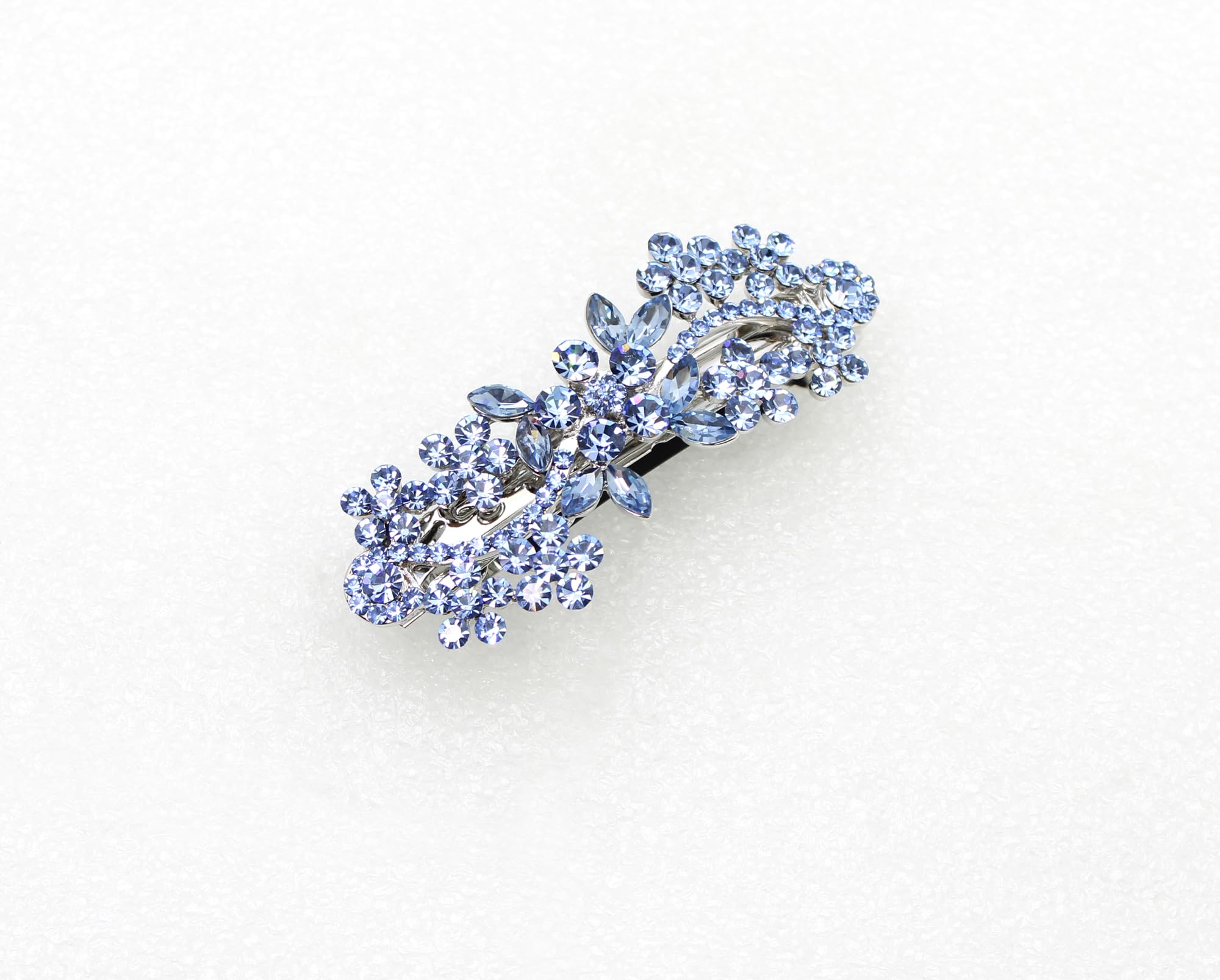 Side profile of rhodium plated alloy metal bar closure on authentic imported bridal hair clip