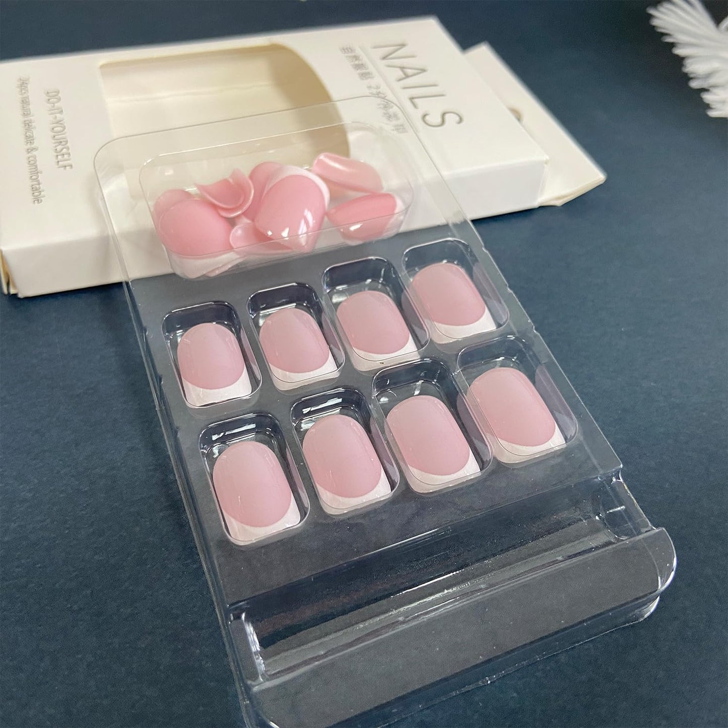 Close up of Nailfy short square French tip artificial nails