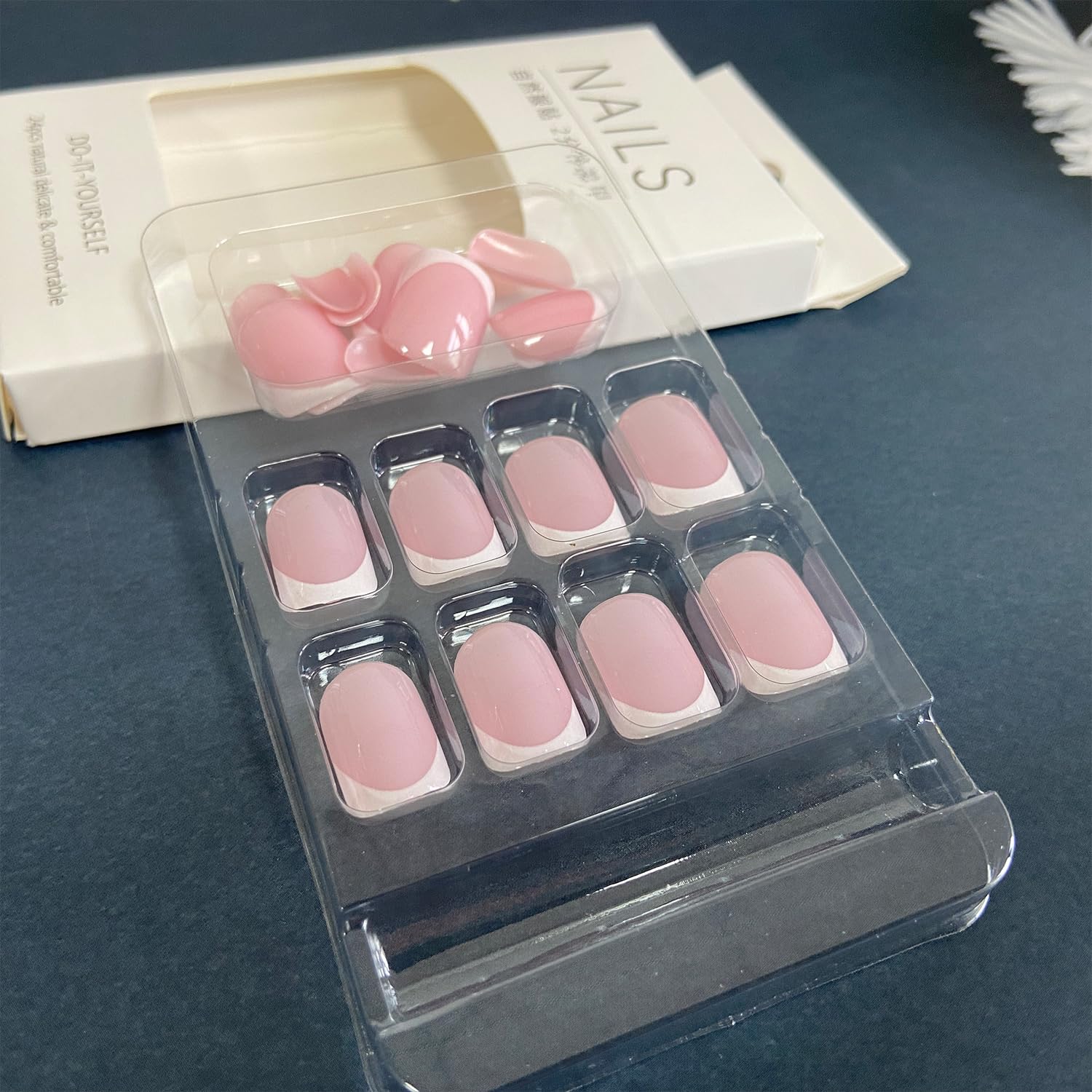 Close up of Nailfy short square French tip artificial nails