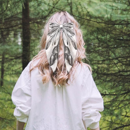 ShiQiao Spl metallic silver oversized bow hair accessory showing the premium fabric texture.