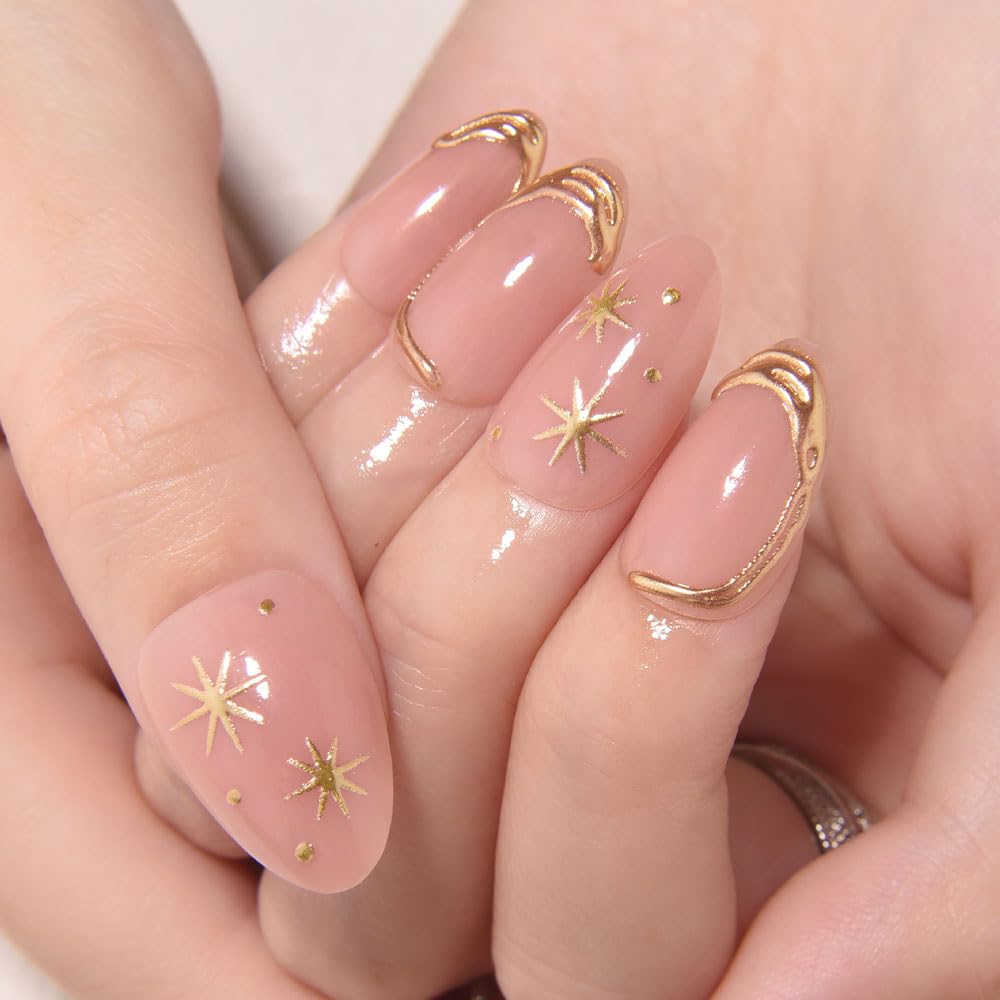 Close up of 3D gold line star detailing on nude glossy press on nails