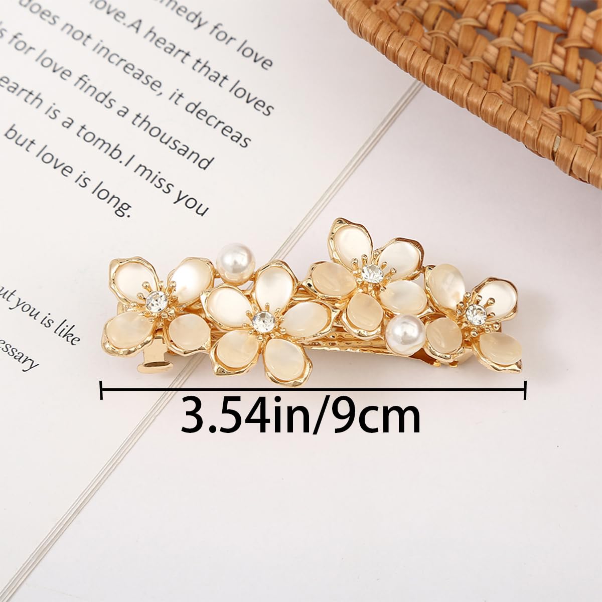 Gold metal French barrettes with premium crystal rhinestones and floral pattern detail