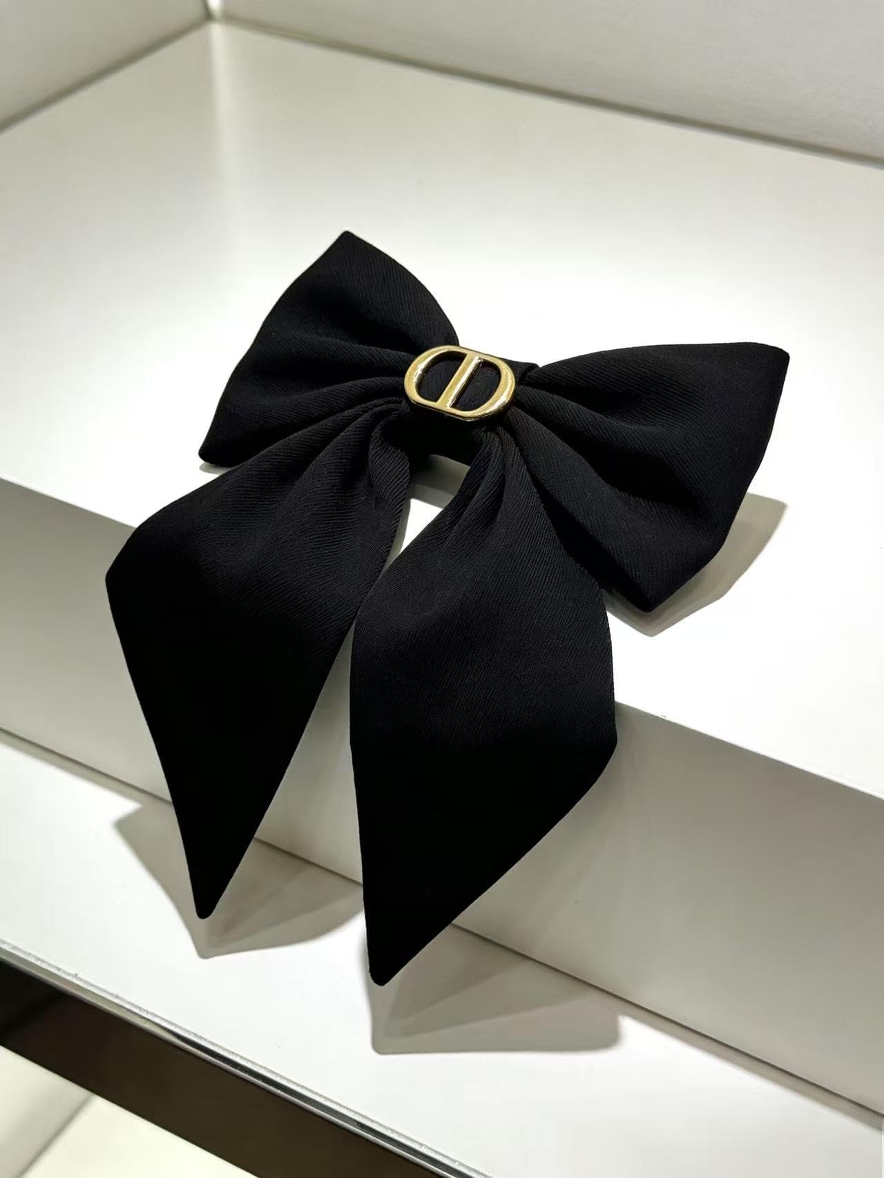 Close up view of the high grip metal barrette backing attached to the fabric bow
