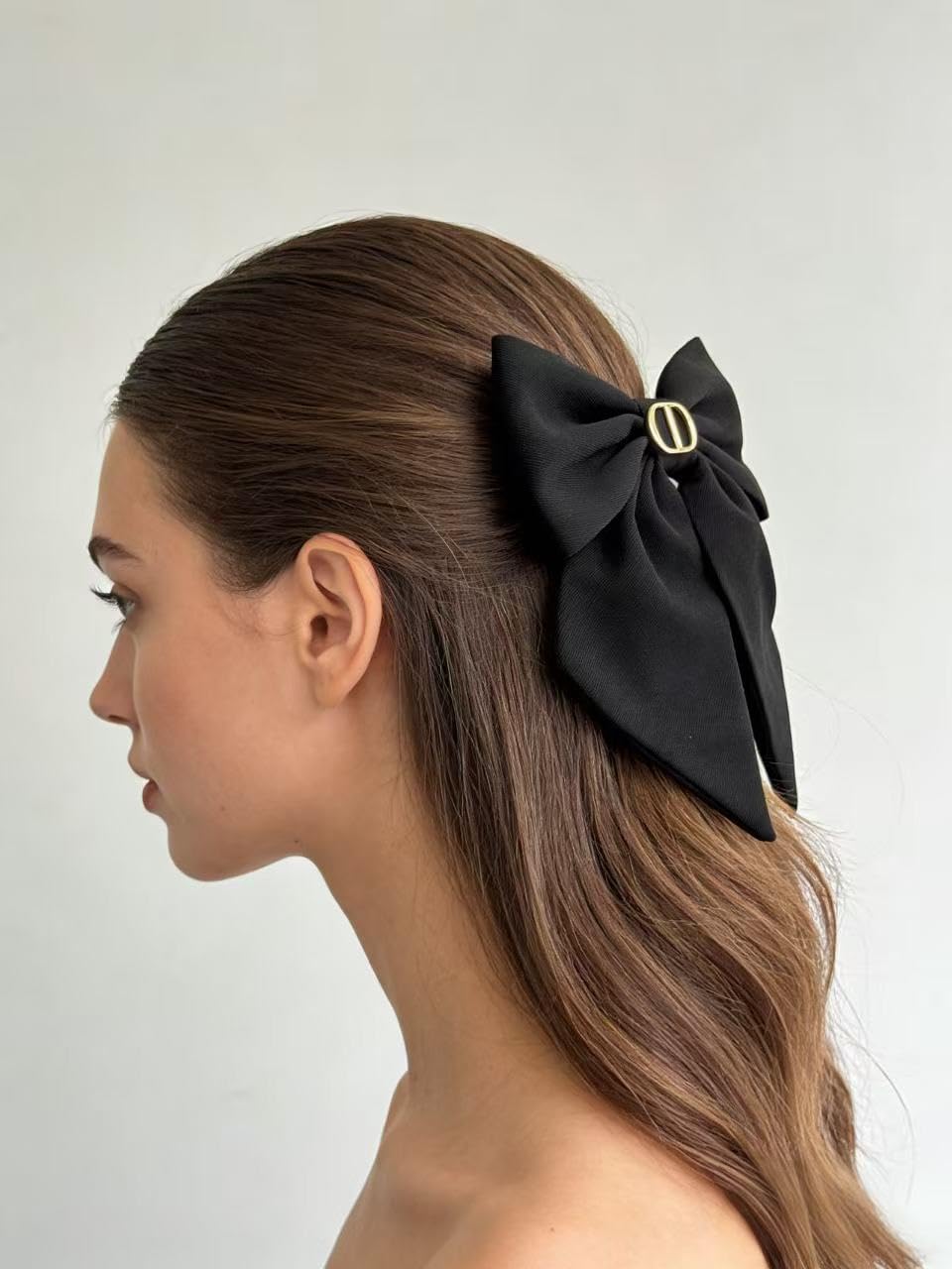 Aesthetic black hair ribbon cascade displaying the smooth and premium textile finish