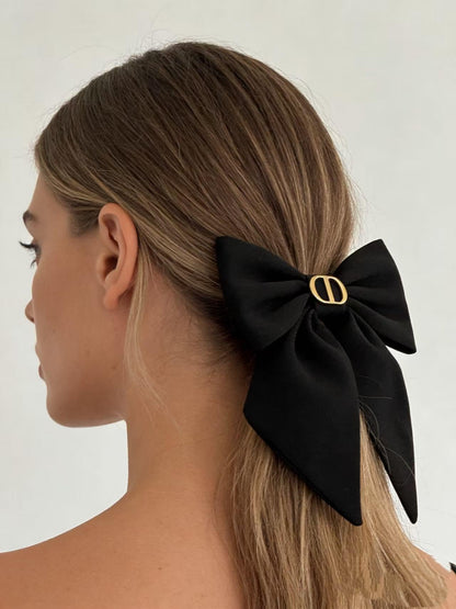 Rudra Retails luxury inspired black fabric bow clip with flowing long tails for women