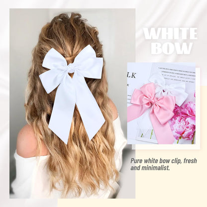 Cinaci large pink satin ribbon hair accessory showcasing the high quality texture and fine stitching.
