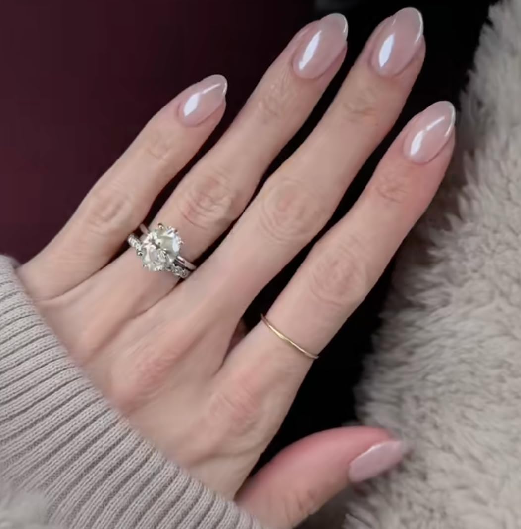 Model wearing CurvLife short oval champagne pearl nails
