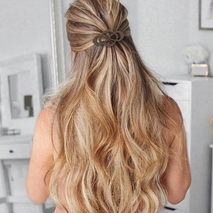 Close up view of the unique crossover design on the mocha brown Amariver hair barrette.