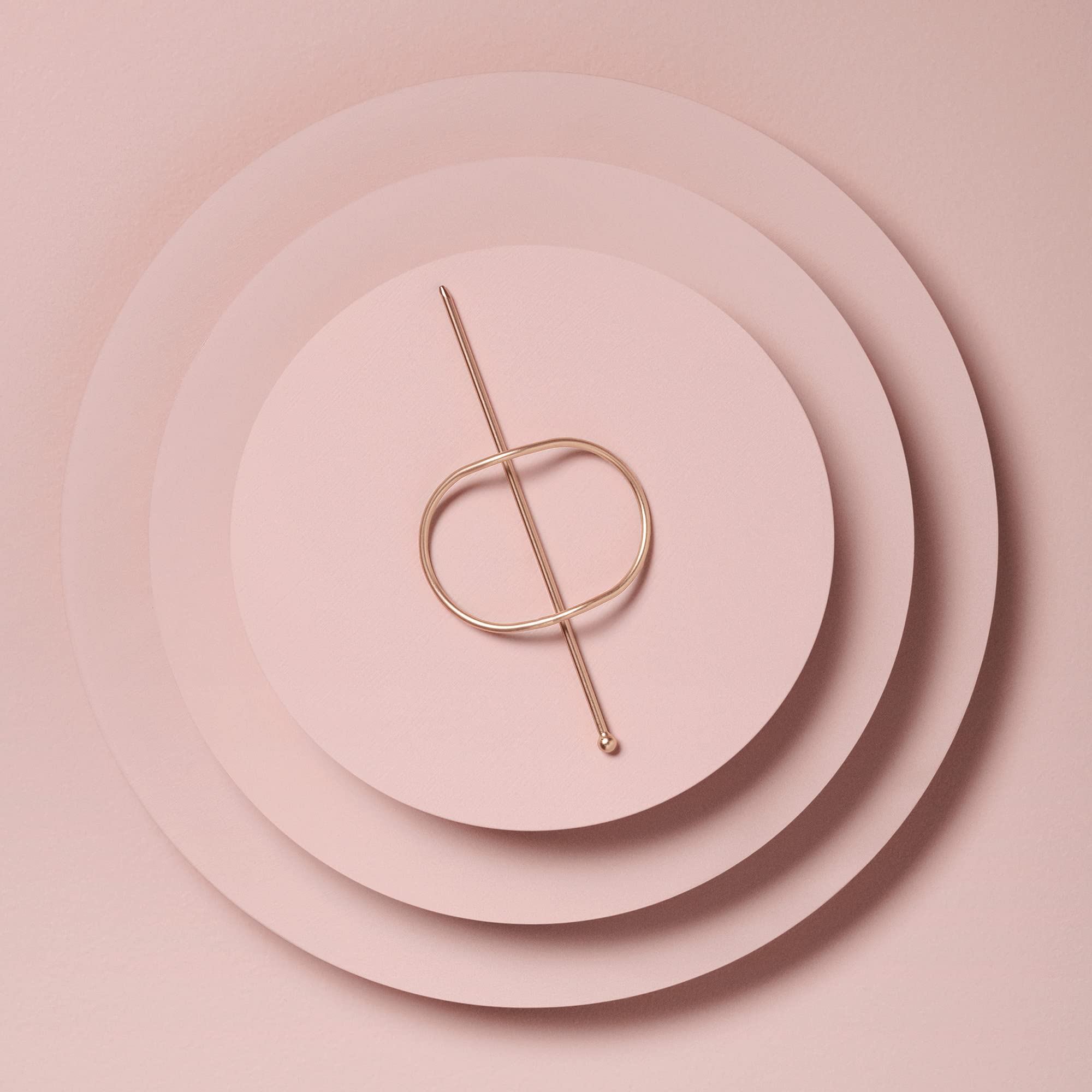 Close up look at the smooth snag free texture of the gold metallic pin accessory.