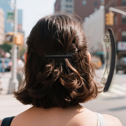 Back angle of the sleek half up hair barrette demonstrating the sturdy toggle closure for secure hold.
