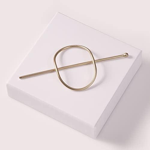 Back view of the gold tone metal barrette showing its durable structural design.
