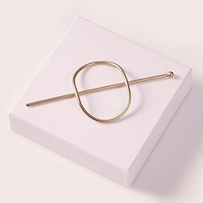 Back view of the gold tone metal barrette showing its durable structural design.