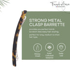 Top-down view highlighting the long and thin profile of the French Amie Tokyo tortoise shell barrette.