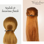 French Amie hair clip displayed to show the polished cellulose acetate texture and rich brown tones.